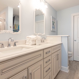 Refresh in the master bath after a day at the beach with a soothing jetted tub and relaxing walk-in shower