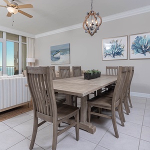Gather around the spacious dining table, enjoying friendly conversations and the refreshing coastal breeze
