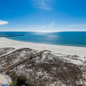Take in the expansive beach views and enjoy the inviting pool area, perfect for relaxation and fun in the sun