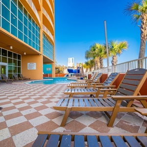 Soak up the sun by the poolside with palm trees and a stunning beachfront view, perfect for your next getaway