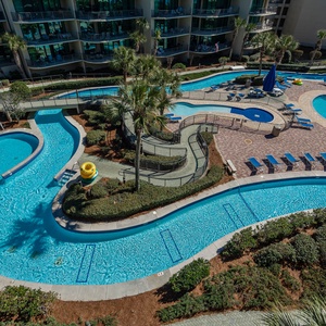 Discover the pool area with a refreshing lazy river and thrilling waterslide, just steps from the bay