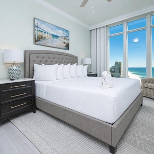 Awaken to a colorful sunrise in this king guest suite with stunning views from the windows
