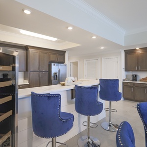 Perch on studded barstools at the marbled counter and sip a chilled drink from the nearby cooler