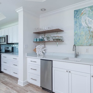 Enjoy a drink from the wet bar with an ice maker or wake up to your favorite brew in the coffee corner with modern upgrades