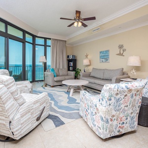 Relax in the cozy family room, featuring a queen sofa sleeper, soaking in the coastal vibes and stunning views