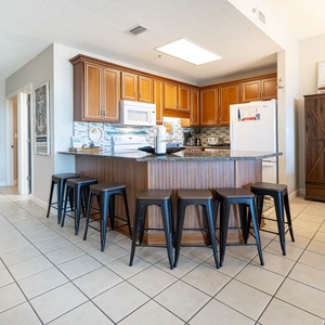 Enjoy meals at the stylish bar seating, with a view of the inviting kitchen and easy access to the dining area