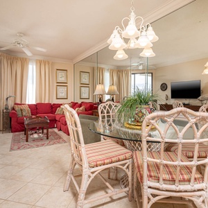 Dine at the glass table surrounded by comfortable seating, with a view that enhances your meal experience