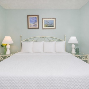 Drift into a restful night in this cozy bedroom, surrounded by serene decor inviting rejuvenation and relaxation