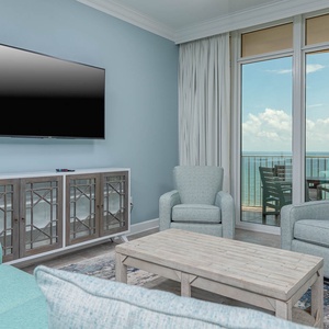 Unwind in on the sofa with a queen sleeper, enjoying coastal views and the gentle sounds of waves from the balcony