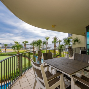 Breathe in the coastal air while lounging on the balcony, surrounded by palms and vibrant views of the bay