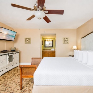 Fluffy pillows and crisp linens welcome you to the king master suite's restful retreat with calming views