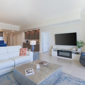 Unwind on the white sofa, stream favorites on the TV, and relax by a cozy fireplace in this inviting space