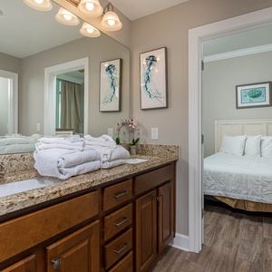 Freshen up in this guest bath in the relaxing shower or soothing tub before an exciting beach day