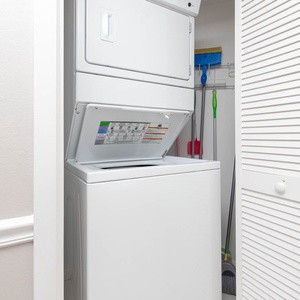 Conveniently handle laundry with this stacked washer and dryer, perfect for freshening up your beach attire