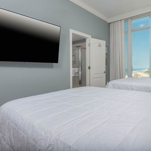 Unwind after a day at the beach in this queen guest suite with your favorite shows and wake to stunning beach views