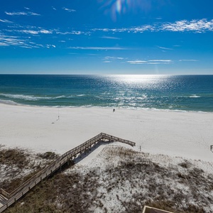Enjoy breathtaking views of the pristine beach and sparkling waters from your private balcony, perfect for relaxation