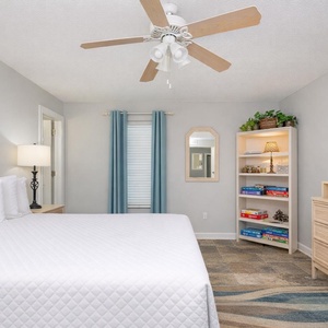 Unwind after a day at the beach with a good movie in this king master suite
