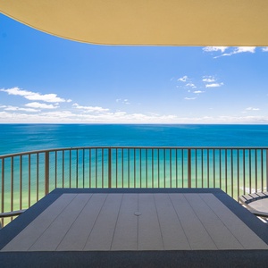 Watch the coastline stretch into the distance and the horizon meet the sky from your balcony while you soak up the sun