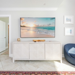 Unwind in this inviting family room and stream shows on the TV while sunlight warms the tile