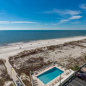 Enjoy breathtaking beachfront views from this inviting space, complete with a refreshing pool just steps away