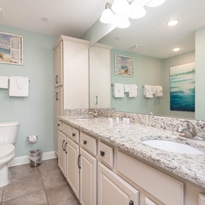 Refresh in the master bath after a day at the beach with a soothing jetted tub and relaxing walk-in shower