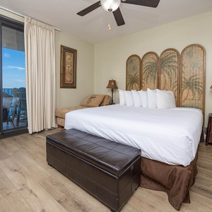 Enjoy restful nights in this master bedroom with a plush king bed and stunning beach views from the balcony
