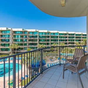 Savor sun-drenched mornings while lounging on the balcony, overlooking the inviting pool area and lush greenery