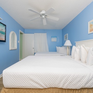 Two queen beds in this guest suite cradle you in peaceful sleep after coastal days filled with adventure