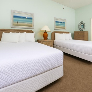 Rest in the plush double beds, surrounded by cheerful decor, while planning your beach adventures together