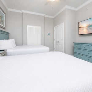 Unwind in this queen guest suite and stream your favorite shows or enjoy a good movie after a beach day