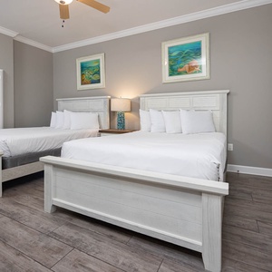 Experience restful nights in this queen guest suite, surrounded by calming decor and inviting natural light