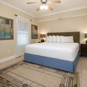 Retreat to the cozy guest bedroom, where thoughtful decor creates a calming vibe and a plush king awaits you
