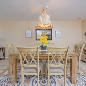 Sit together at the dining table, surrounded by cheerful decor, creating lasting memories in a cozy vibe
