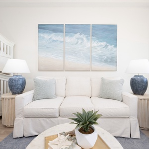 Sink into this gorgeous, designer inspired sofa and unwind in comfort after a day at the beach