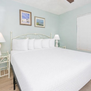 Drift into relaxation in the king suite on the soft, plush bed as tranquil colors and coastal decor enhance your stay
