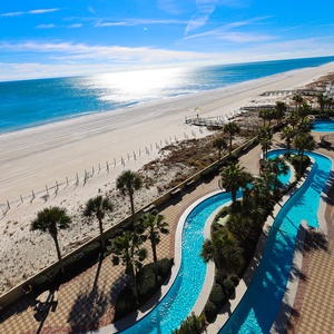 Discover the refreshing pool area with gradual entry, indoor hot tubs and pool, lazy river, and waterslide