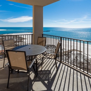 Enjoy meals or morning coffee at the round table while taking in the beautiful coastal views from your balcony