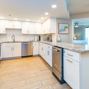 Create delicious meals together in this inviting kitchen, where modern finishes enhance your cooking experience