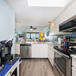 This kitchen features additional appliances, including a Keurig and coffee pot, perfect for the morning rise and shine
