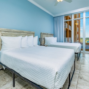 Enjoy coastal views from the windows in this queen guest suite, perfect for relaxing after a day at the beach