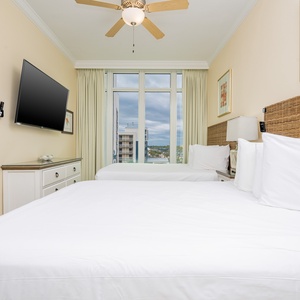 Rest peacefully in queen beds, enjoying your favorite shows while soaking in views through large windows