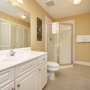 Refresh in this additional guest bath with a walk-in shower and laundry area with a washer and dryer in your rental