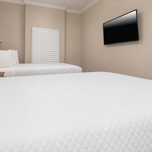 Unwind in this queen guest suite and stream your favorite shows or enjoy a good movie after a beach day