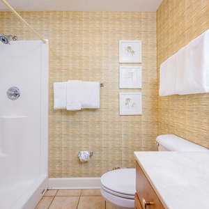 Freshen up in this guest bath in the relaxing shower or soothing tub before an exciting day