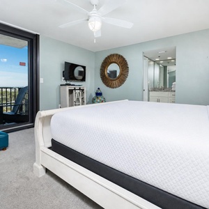 Inviting master bedroom featuring a king bed, stylish decor, and an area view from the master balcony