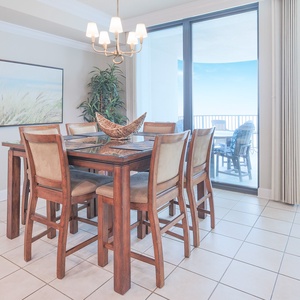 Dine comfortably at the stylish table with ample seating, complemented by views through large glass doors