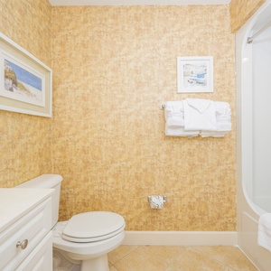 Freshen up in this guest bath in the relaxing shower or soothing tub before an exciting day