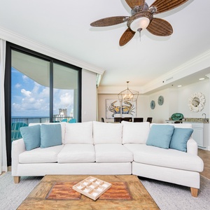Unwind on the spacious sectional with queen sleeper while enjoying the coastal decor and views from the large windows