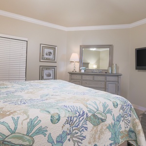Elegant master bedroom with a king bed, soft lighting, and stylish decor for a restful night's sleep