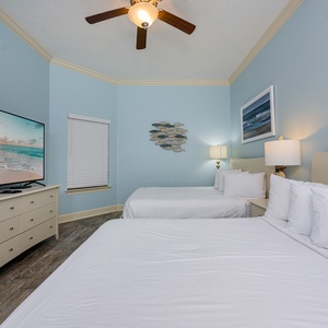 Unwind in this queen guest suite and stream your favorite shows or enjoy a good movie after a beach day